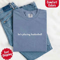 He’s Playing Basketball – Funny Sports Girlfriend Comfort Color Shirt for Women